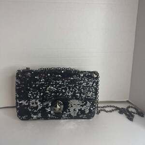 Apt. 9 This is a black and silver sequin clutch handbag